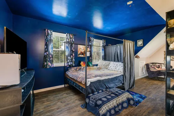 a backyard of a house with table and chairs