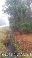 11932 Ramallah Road Jacksonville, FL 32219 - Photo 2 of 2 11932 Ramallah - Front Pic with stream