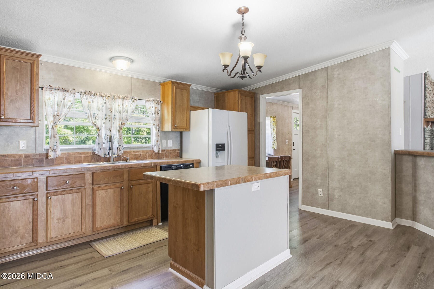 398 Jeffrey Way Forsyth, GA 31029 - Photo 16 of 34 a kitchen with stainless steel appliances granite countertop a stove oven and a refrigerator