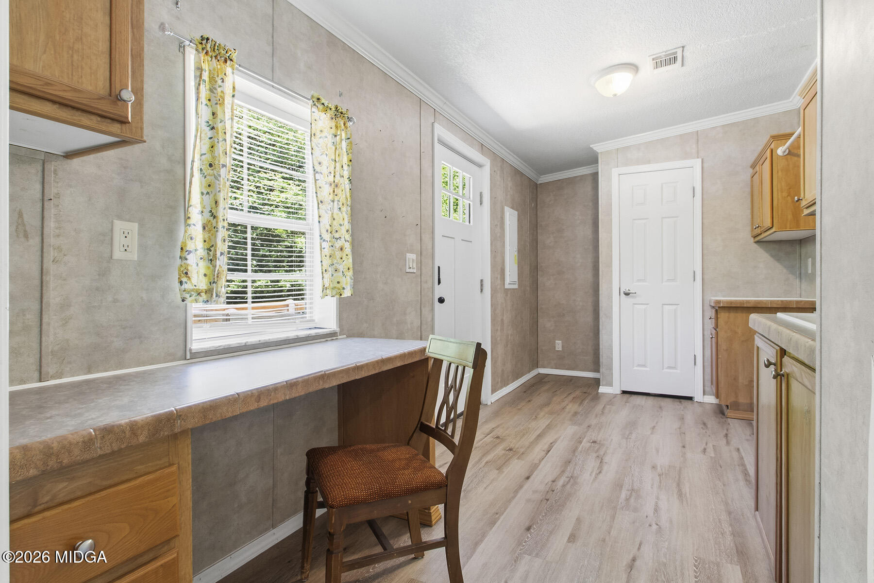 398 Jeffrey Way Forsyth, GA 31029 - Photo 17 of 34 a workspace with wooden floor and a window
