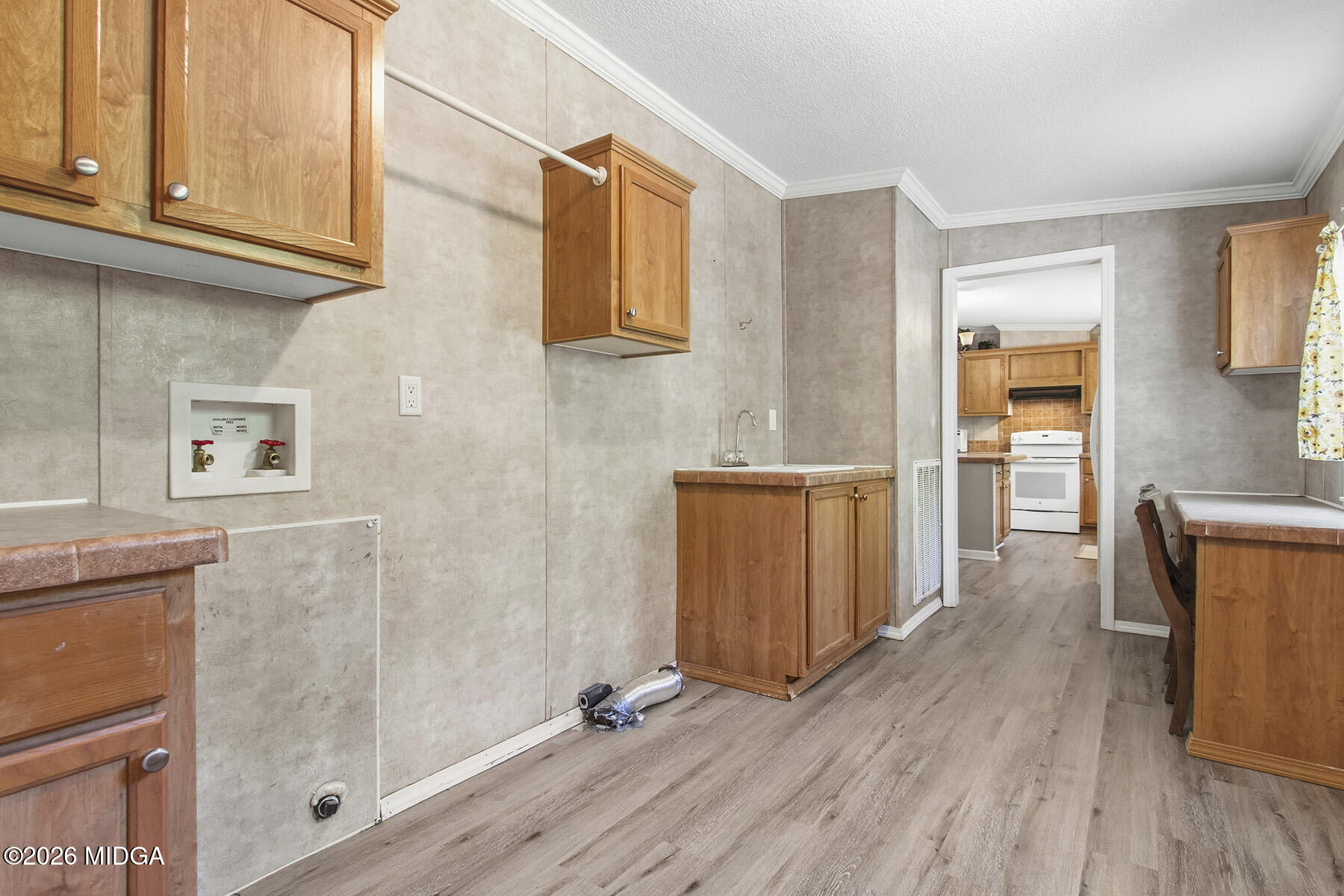398 Jeffrey Way Forsyth, GA 31029 - Photo 18 of 34 a view of kitchen with furniture and wooden floor