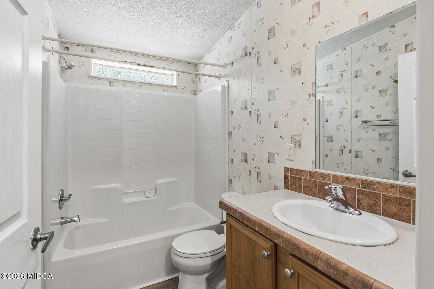 398 Jeffrey Way Forsyth, GA 31029 - Photo 23 of 34 a bathroom with a sink toilet and shower