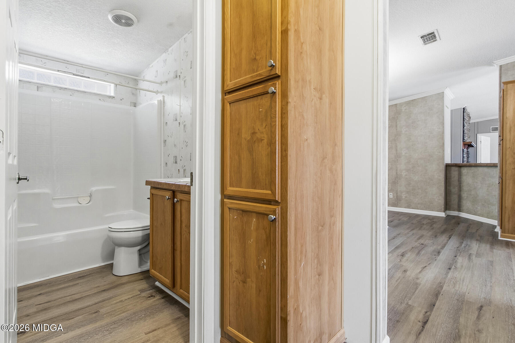 398 Jeffrey Way Forsyth, GA 31029 - Photo 24 of 34 a bathroom with a granite countertop bathtub shower sink vanity and toilet