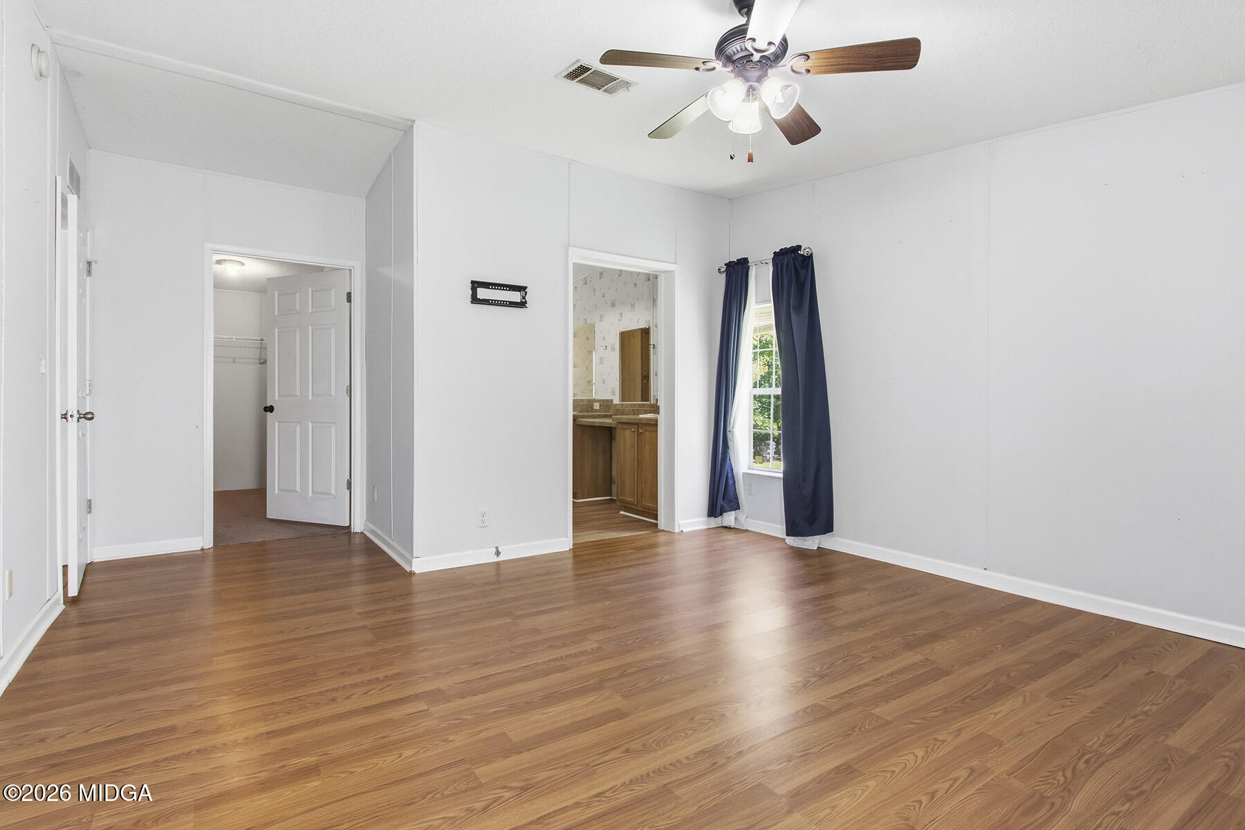 398 Jeffrey Way Forsyth, GA 31029 - Photo 26 of 34 wooden floor in an empty room with a window