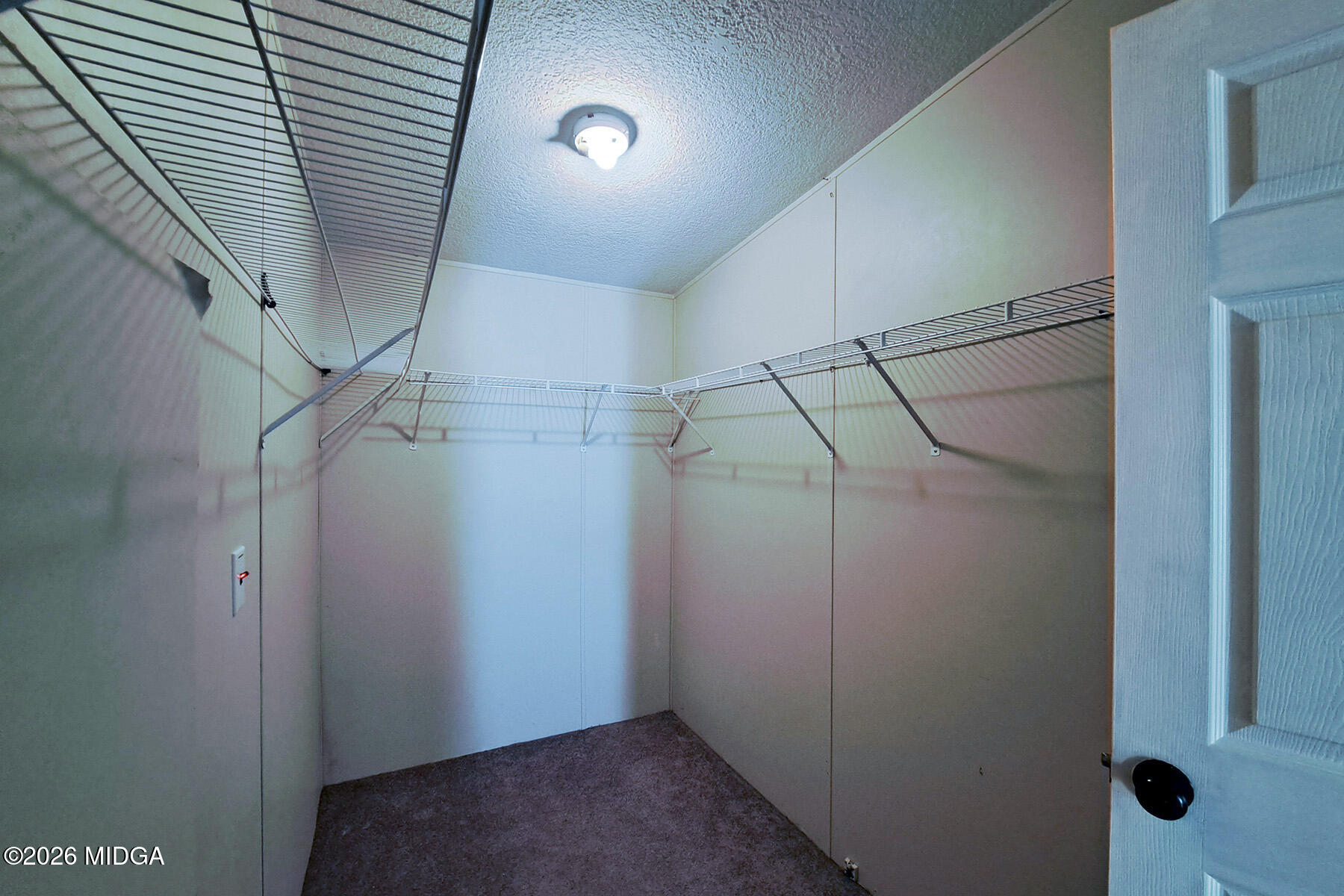 398 Jeffrey Way Forsyth, GA 31029 - Photo 27 of 34 a view of a room with racks on the wall