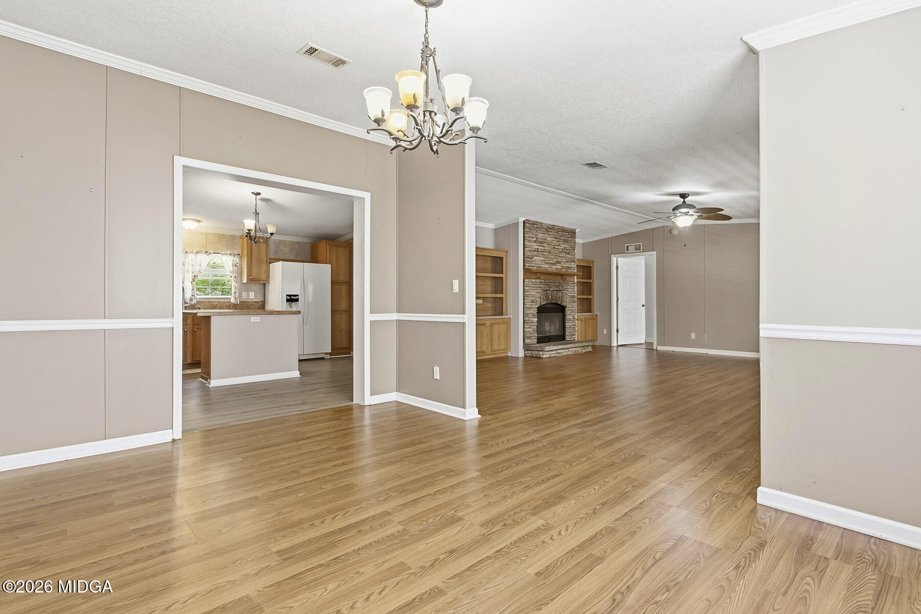 398 Jeffrey Way Forsyth, GA 31029 - Photo 10 of 34 wooden floor in an empty room with a window