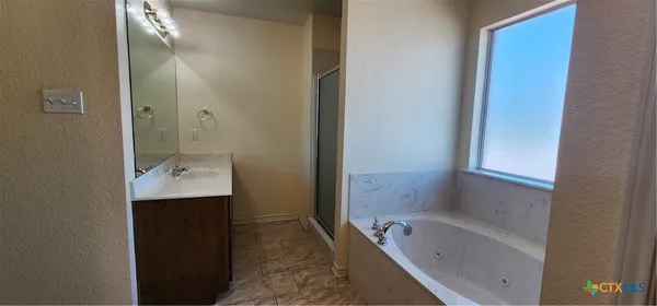 a bathroom with a sink and mirror