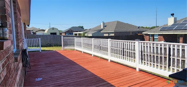 a balcony with table and chairs