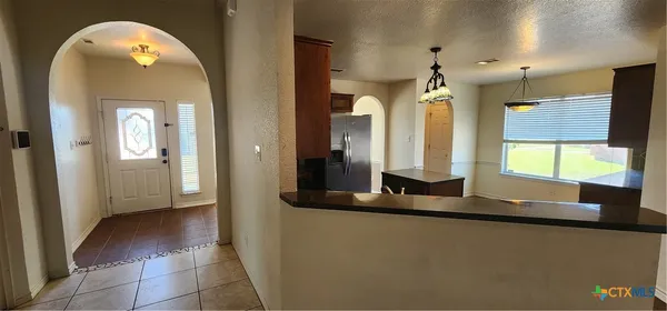 a view of a hallway with windows
