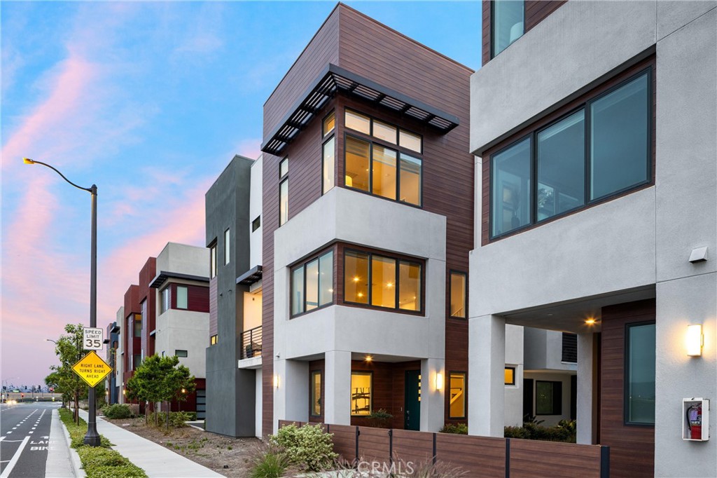 225 Waypoint Tustin, CA 92782 - Photo 1 of 1 a front view of a multi story residential apartment building