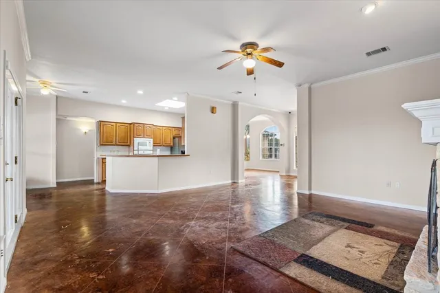 a kitchen with granite countertop a sink stove and cabinets