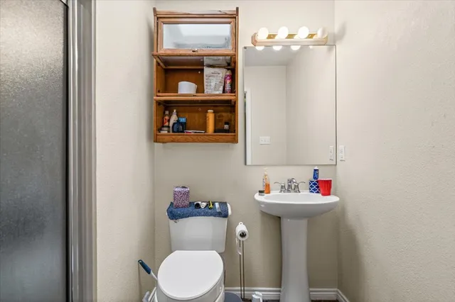 a view of a storage and utility room with washer and dryer