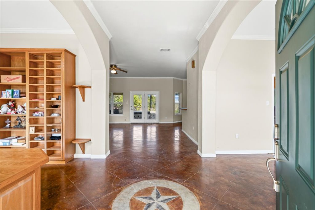 101 Valley Vista Road Wimberley, TX 78676 - Photo 4 of 23 The grand entrance welcomes you with a striking custom star-pattern inlay set into the oversized tile flooring.