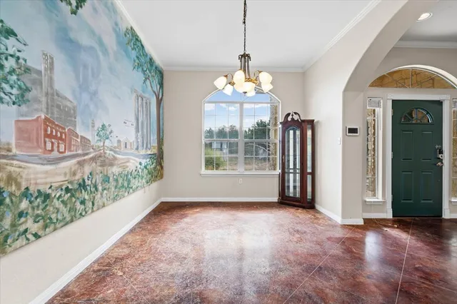 a view of a room with large windows