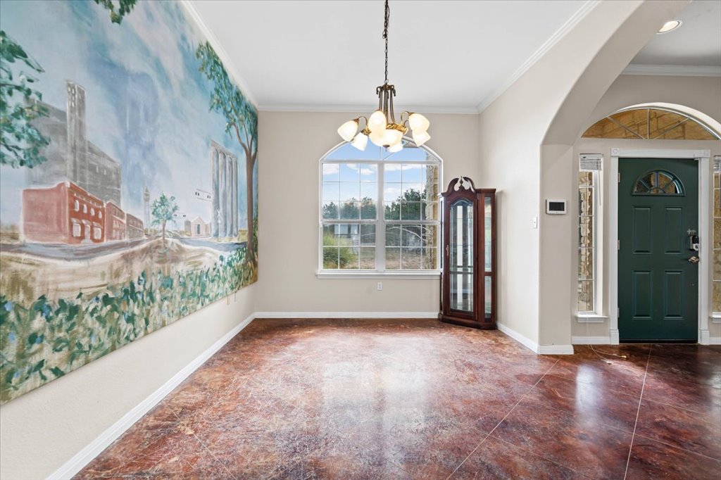 101 Valley Vista Road Wimberley, TX 78676 - Photo 7 of 23 The dining space is framed by large windows offering peaceful views of the surrounding greenery, creating a perfect backdrop for gatherings.