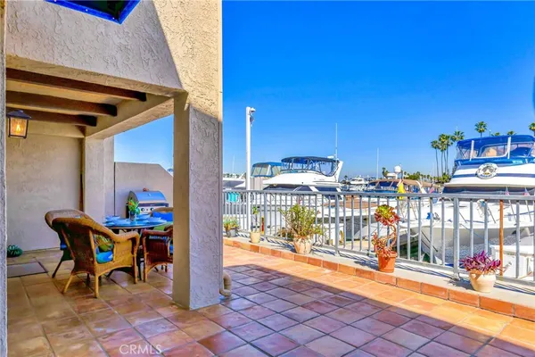 a view of a patio with a table and chairs