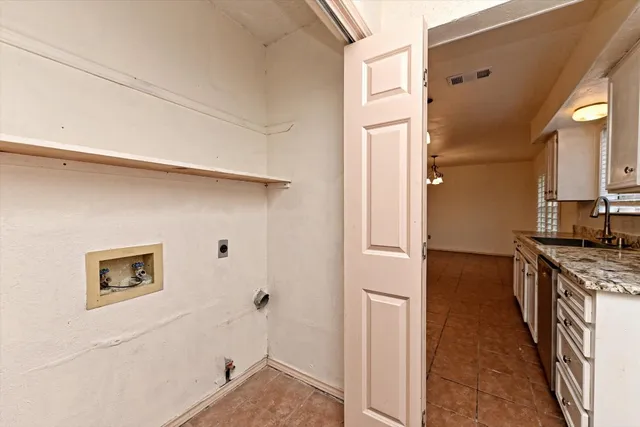 a kitchen with a refrigerator and a stove