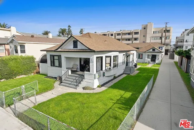 a view of a house with a yard porch and sitting area
