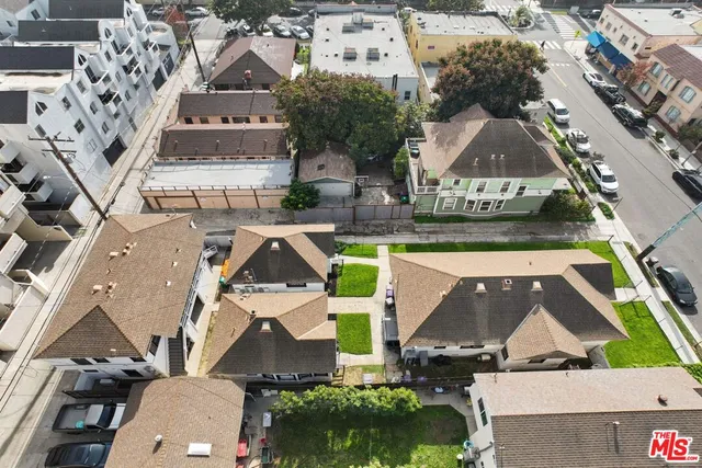 an aerial view of a house with a swimming pool