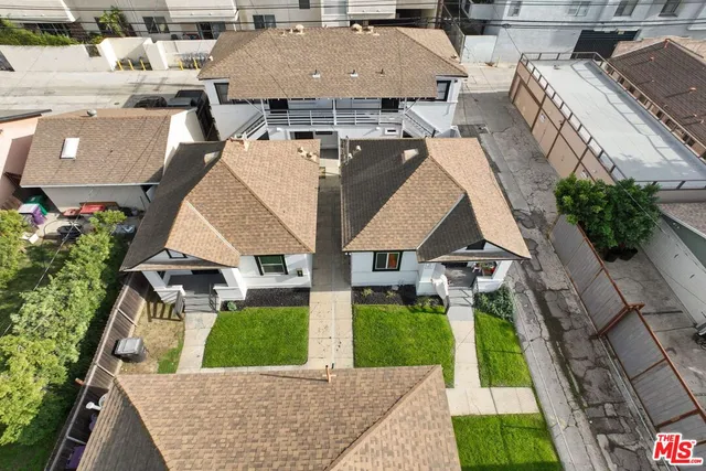 an aerial view of a house with swimming pool