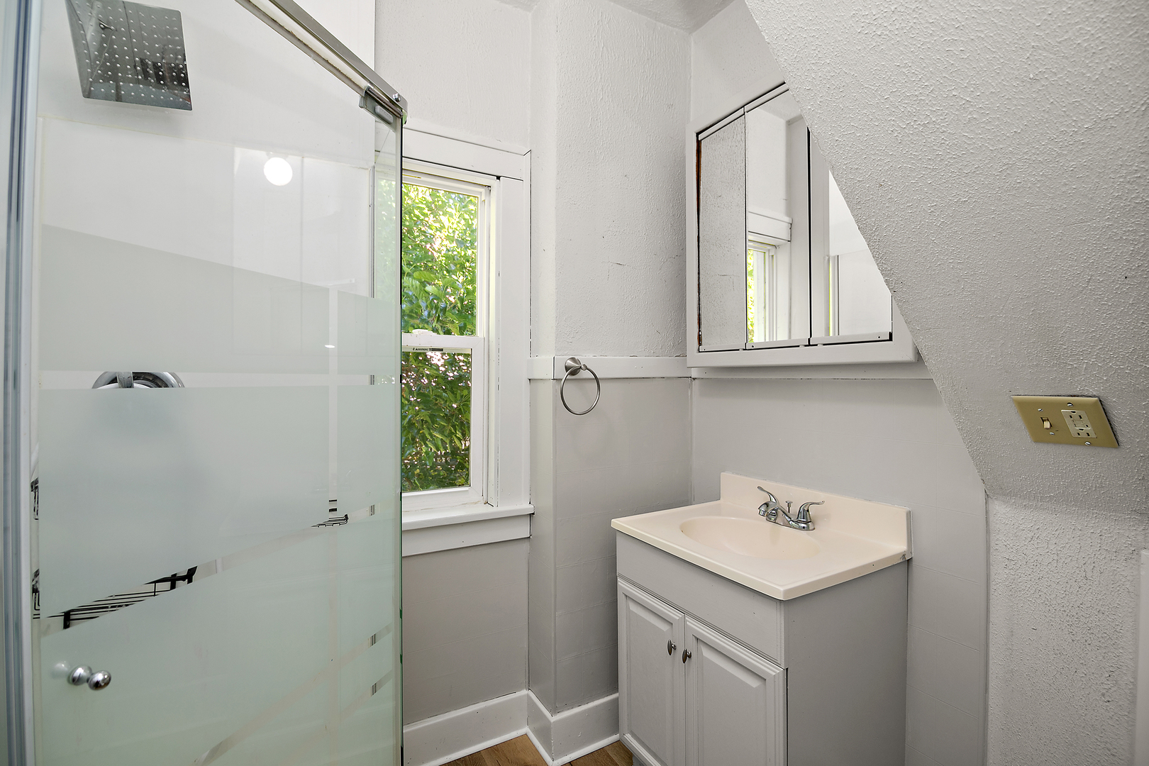 1179 South 4th Avenue Kankakee, IL 60901 - Photo 11 of 18 a bathroom with a sink and a window