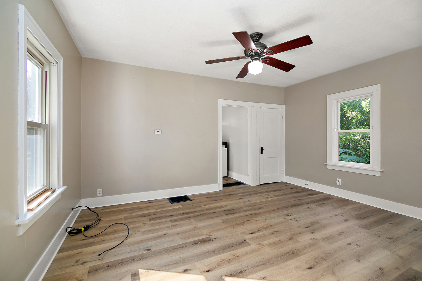 1179 South 4th Avenue Kankakee, IL 60901 - Photo 6 of 18 a view of a livingroom with a ceiling fan and window