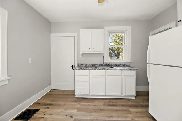 a bathroom with a sink and a window