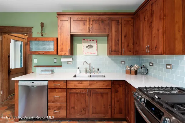 a dining room with furniture a rug and a large window
