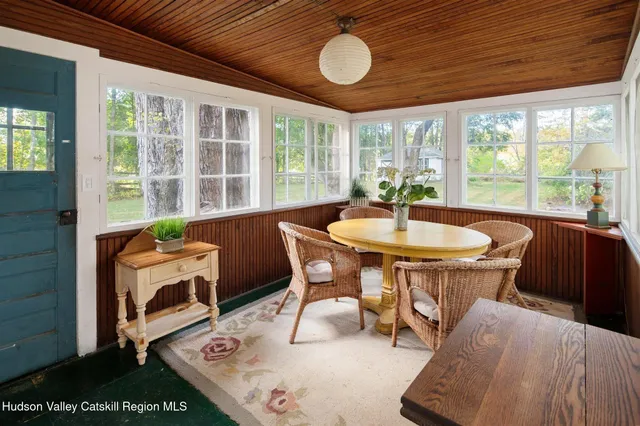 a bathroom with a sink mirror and a shower