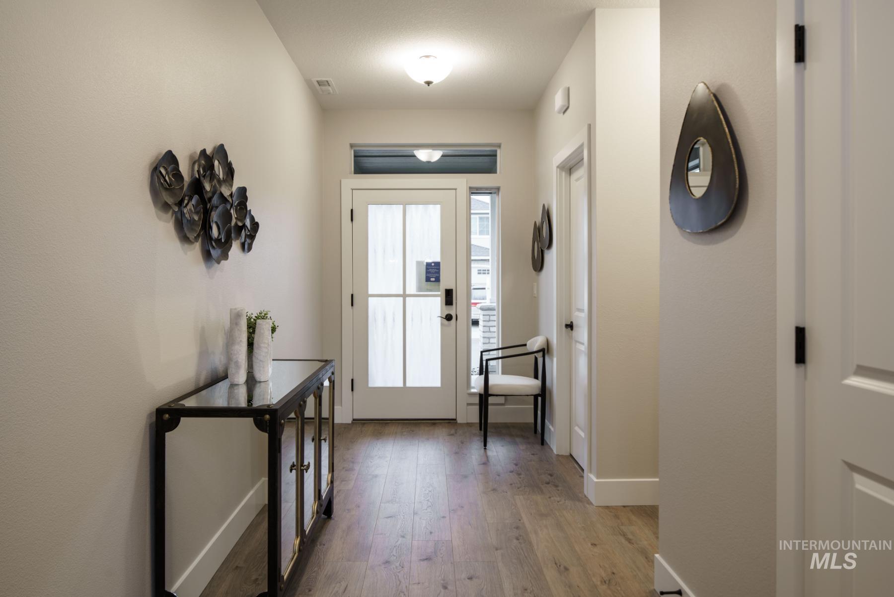 1009 West Malbar Street Meridian, ID 83646 - Photo 2 of 10 Foyer featuring light wood-type flooring and baseboards