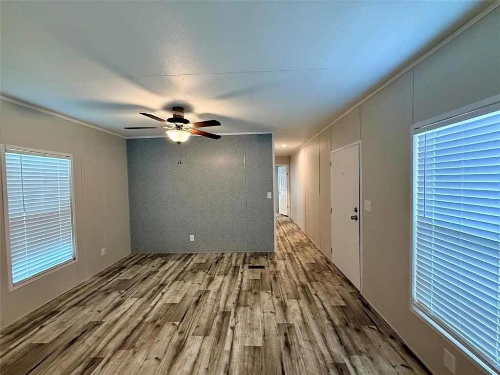 3193 Timberwild Street Wills Point, TX 75169 - Photo 2 of 13 a view of a livingroom with a ceiling fan and window