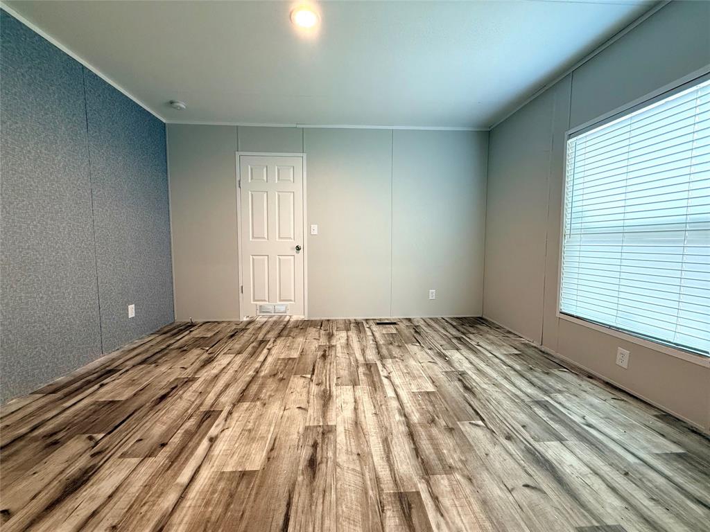 3193 Timberwild Street Wills Point, TX 75169 - Photo 7 of 13 a view of a room with wooden floor and window