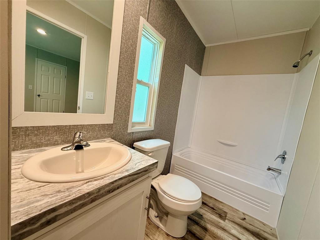 3193 Timberwild Street Wills Point, TX 75169 - Photo 8 of 13 a bathroom with a sink toilet and shower