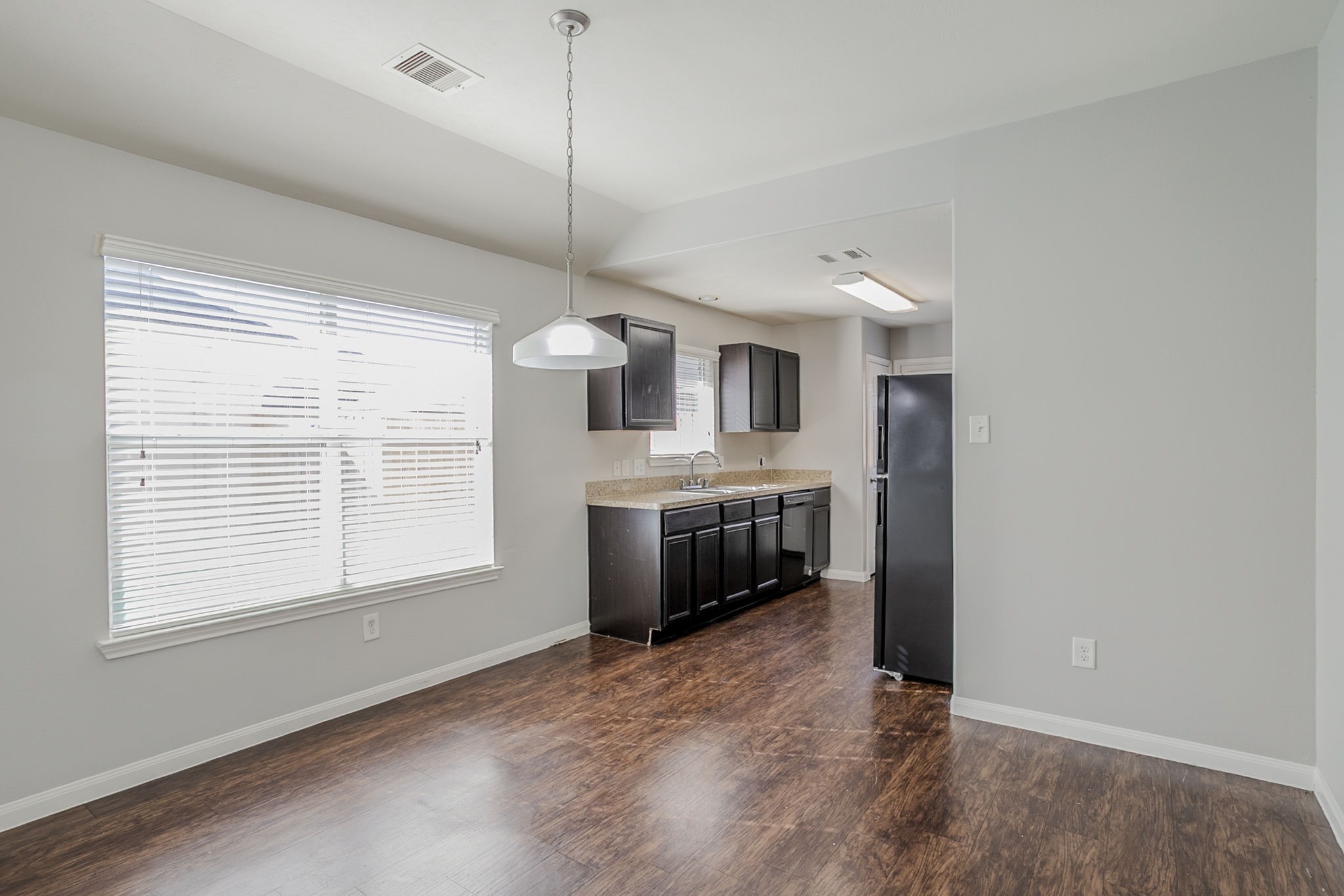 21431 Ryans Path Lane Houston, TX 77073 - Photo 14 of 38 a kitchen with stainless steel appliances granite countertop a stove a sink and a wooden floor