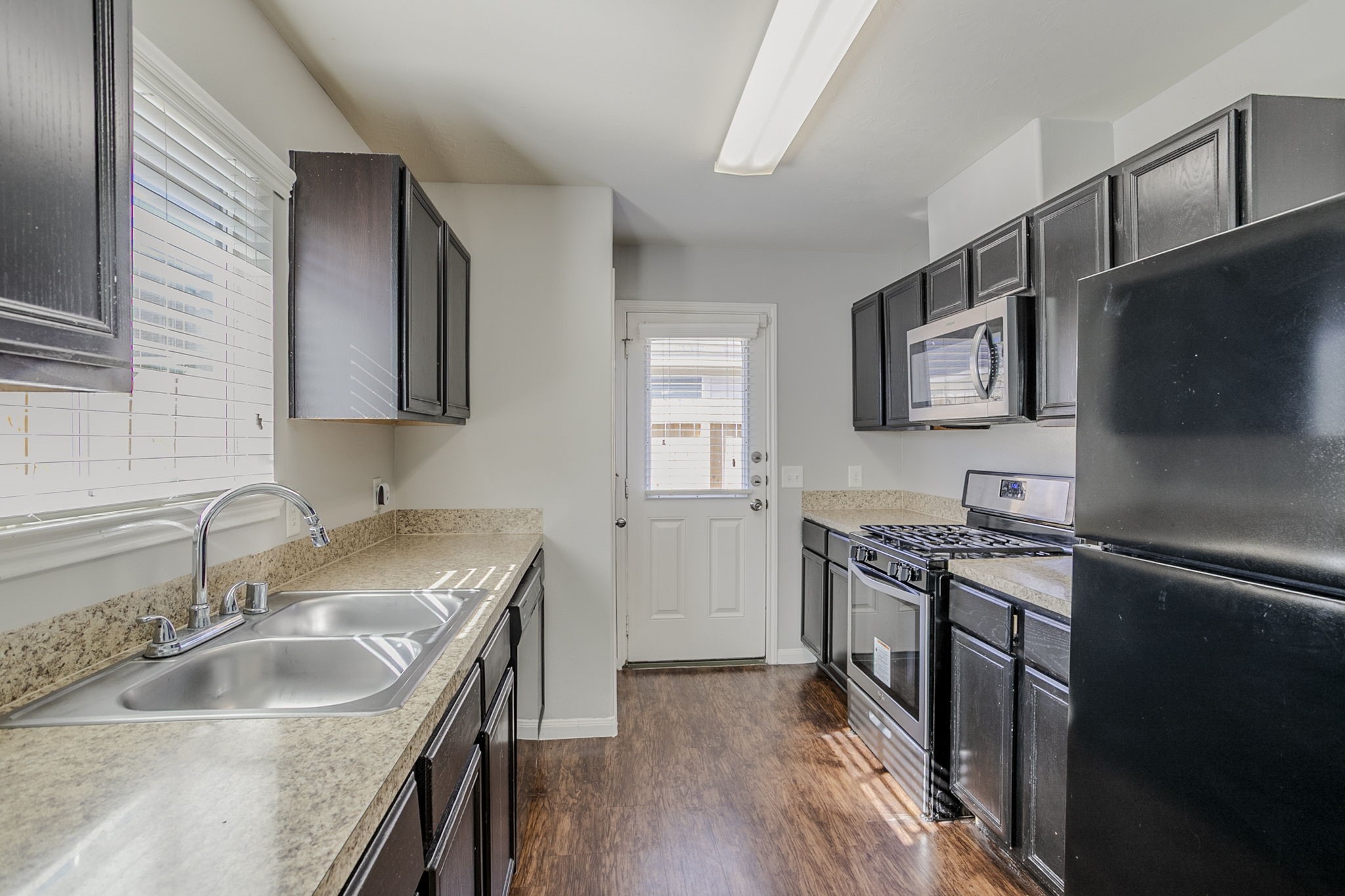 21431 Ryans Path Lane Houston, TX 77073 - Photo 16 of 38 a kitchen with stainless steel appliances granite countertop a sink stove and refrigerator