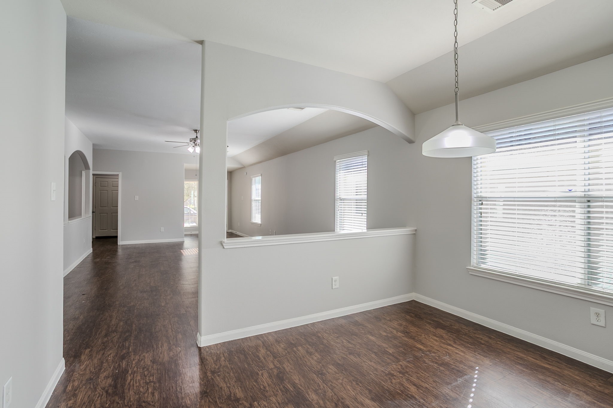 21431 Ryans Path Lane Houston, TX 77073 - Photo 18 of 38 a view of a room with window wooden floor and chandelier