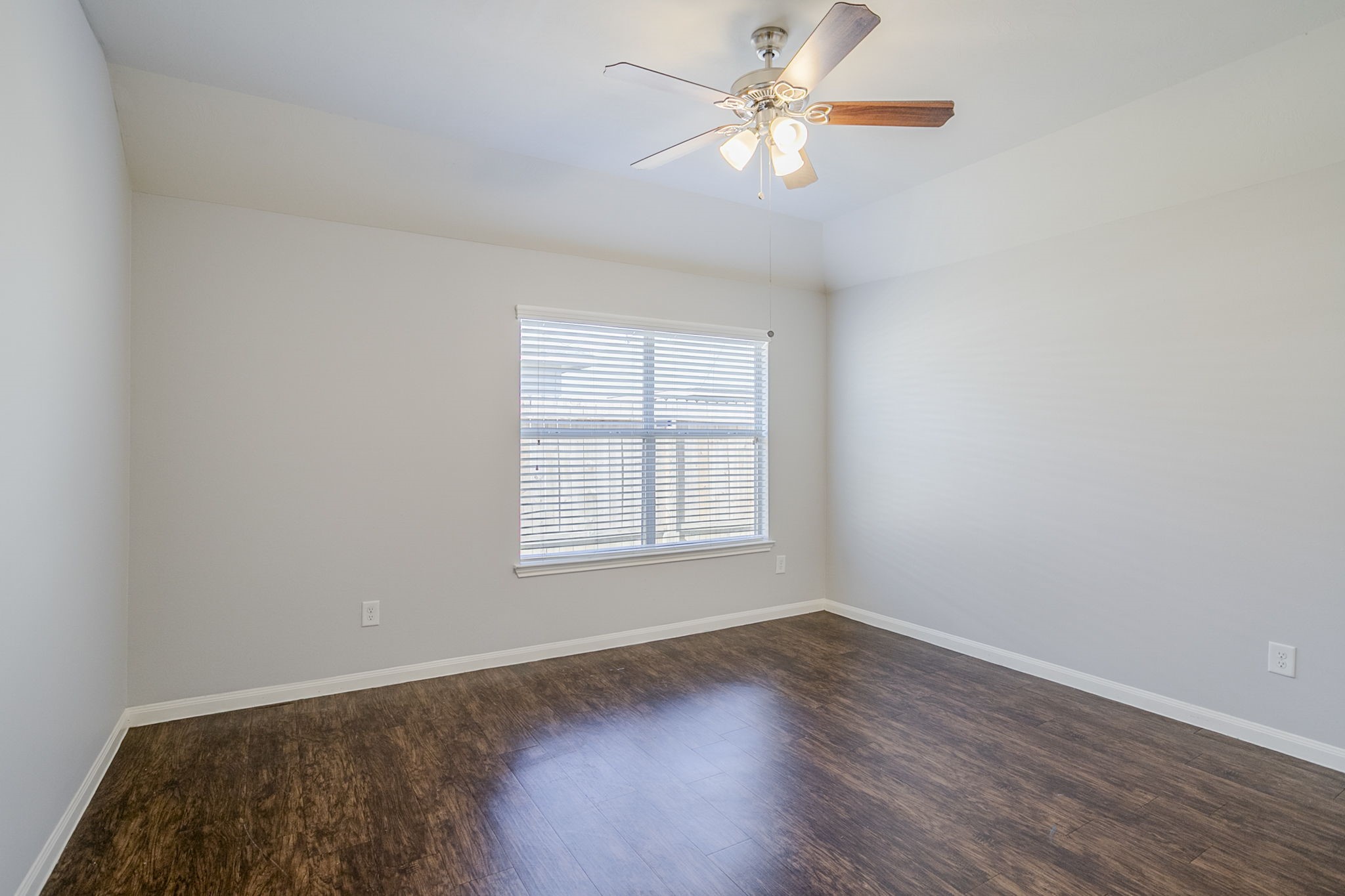 21431 Ryans Path Lane Houston, TX 77073 - Photo 19 of 38 an empty room with wooden floor fan and windows