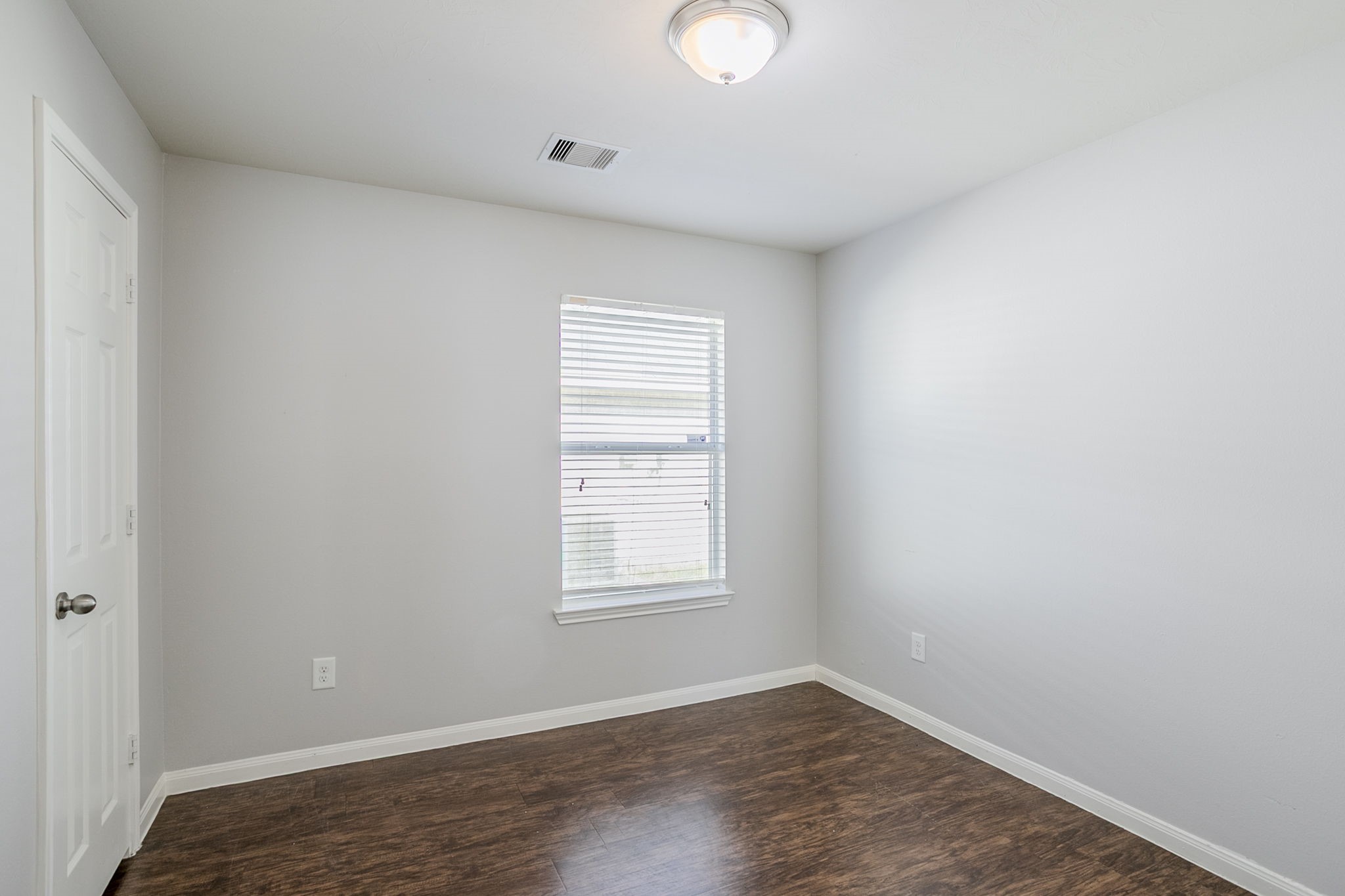 21431 Ryans Path Lane Houston, TX 77073 - Photo 27 of 38 an empty room with wooden floor and windows