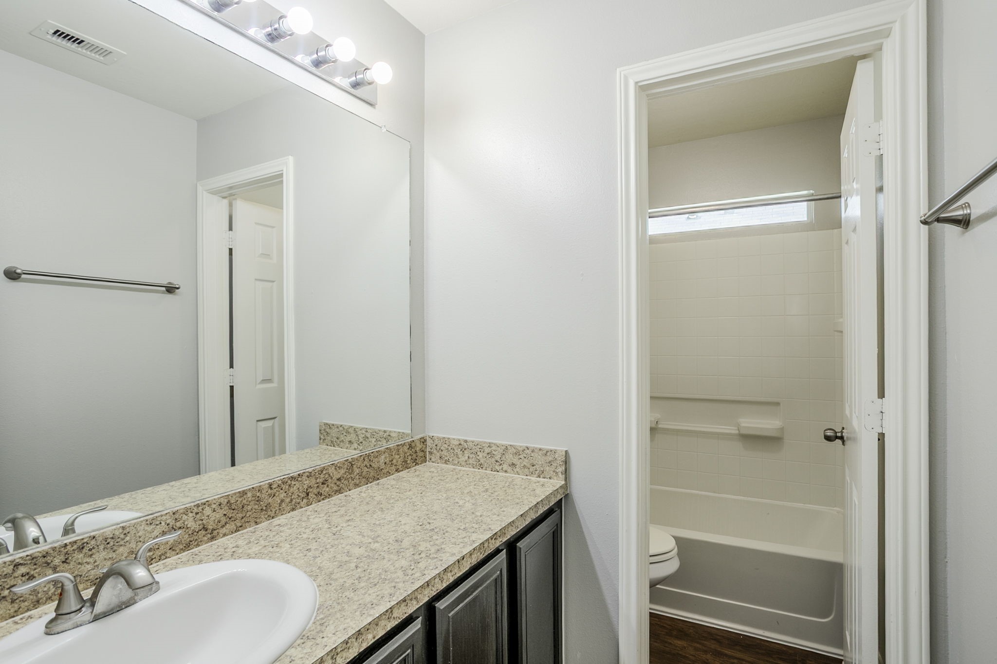 21431 Ryans Path Lane Houston, TX 77073 - Photo 30 of 38 a bathroom with a granite countertop sink and a mirror