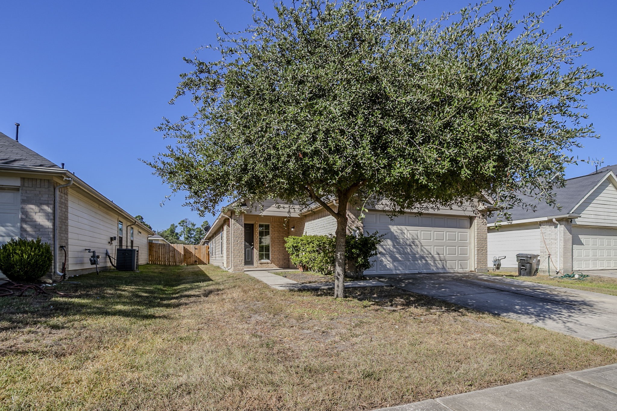 21431 Ryans Path Lane Houston, TX 77073 - Photo 3 of 38 a front view of a house with a yard and garage
