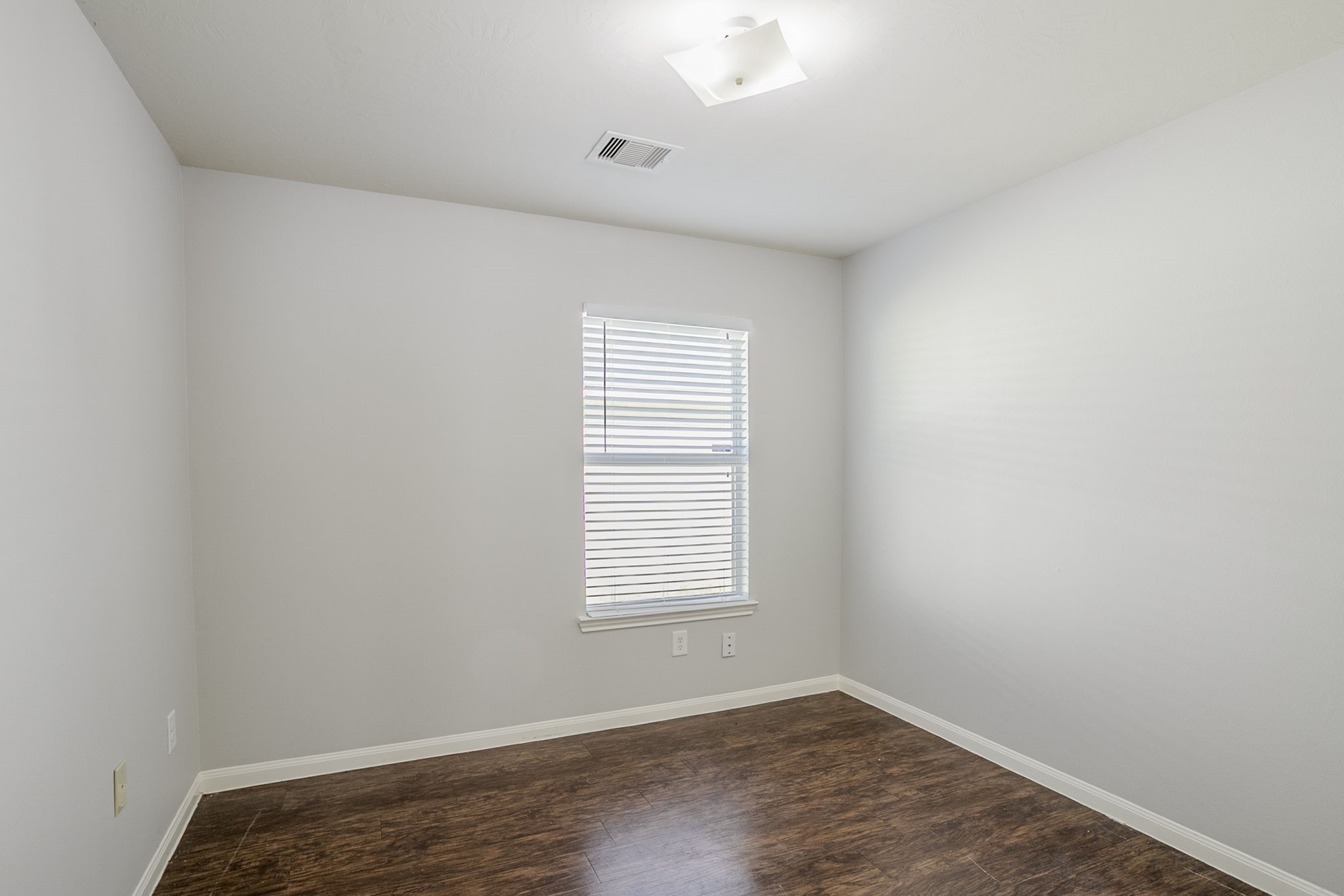 21431 Ryans Path Lane Houston, TX 77073 - Photo 31 of 38 an empty room with wooden floor and windows