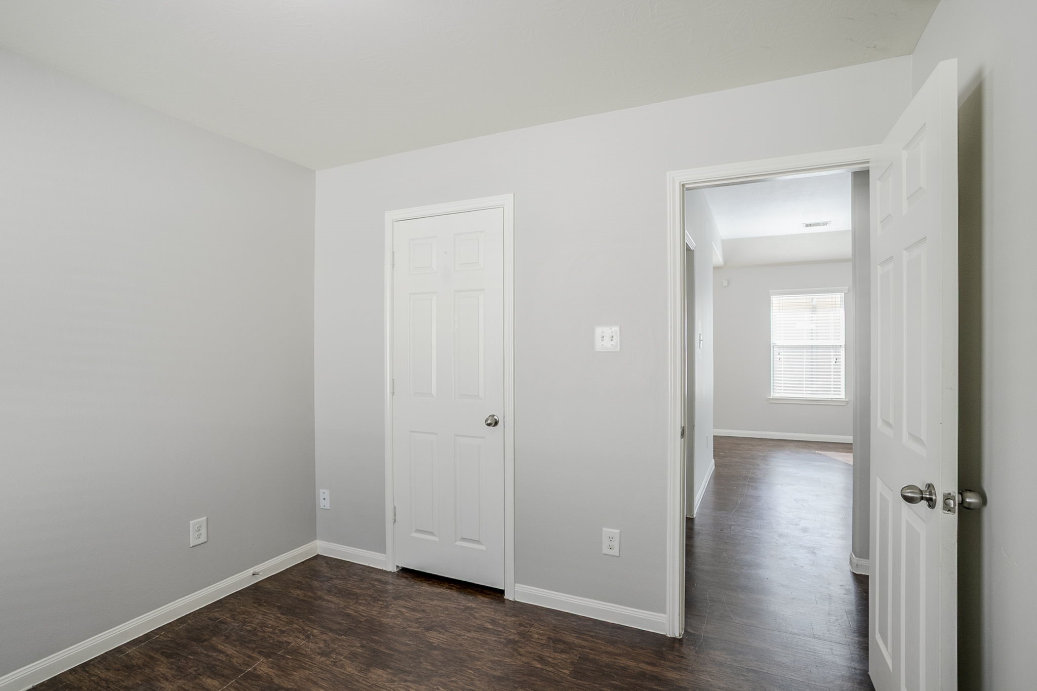 21431 Ryans Path Lane Houston, TX 77073 - Photo 32 of 38 an empty room with wooden floor closet and windows