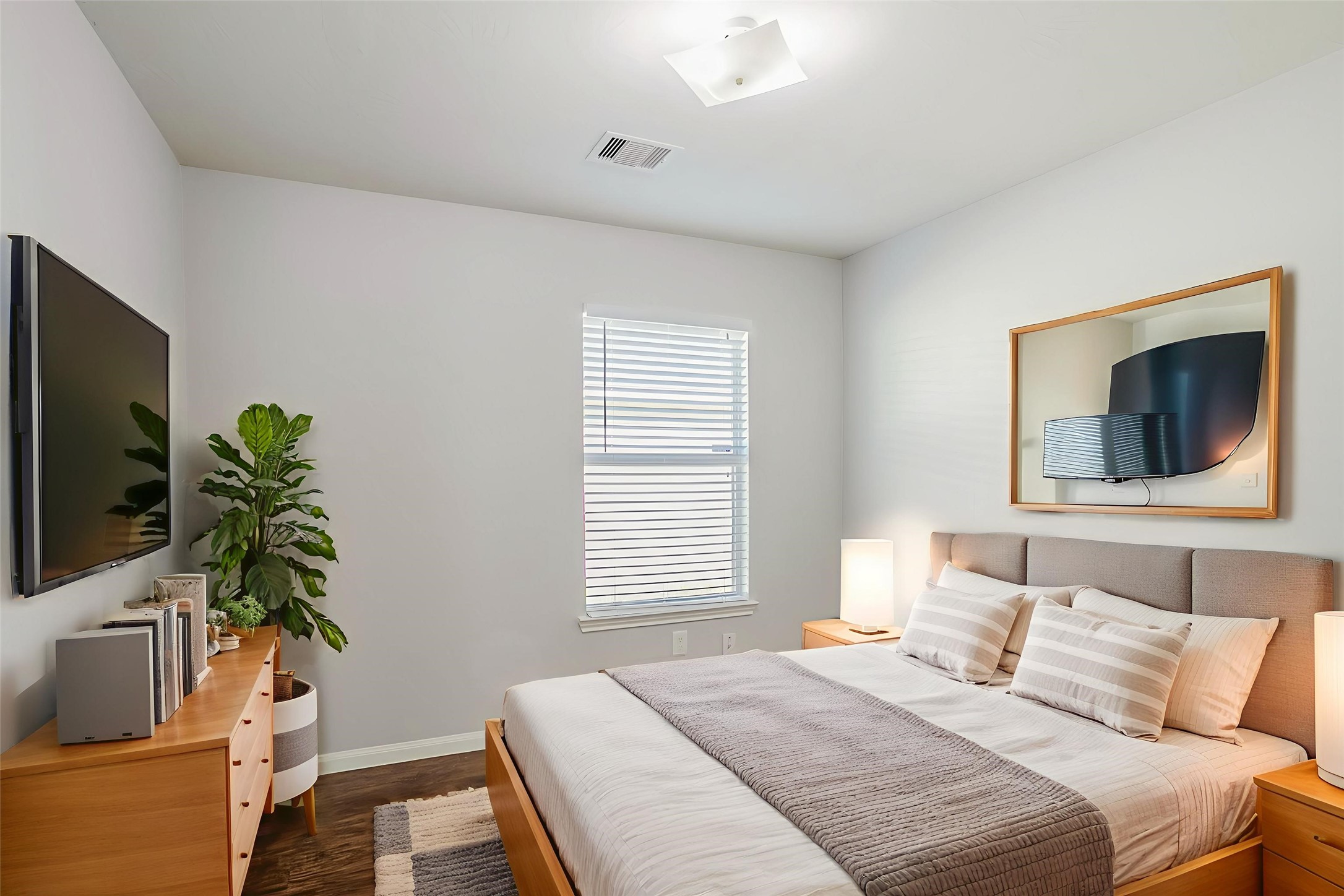 21431 Ryans Path Lane Houston, TX 77073 - Photo 8 of 38 a bedroom with a bed and a flat screen tv