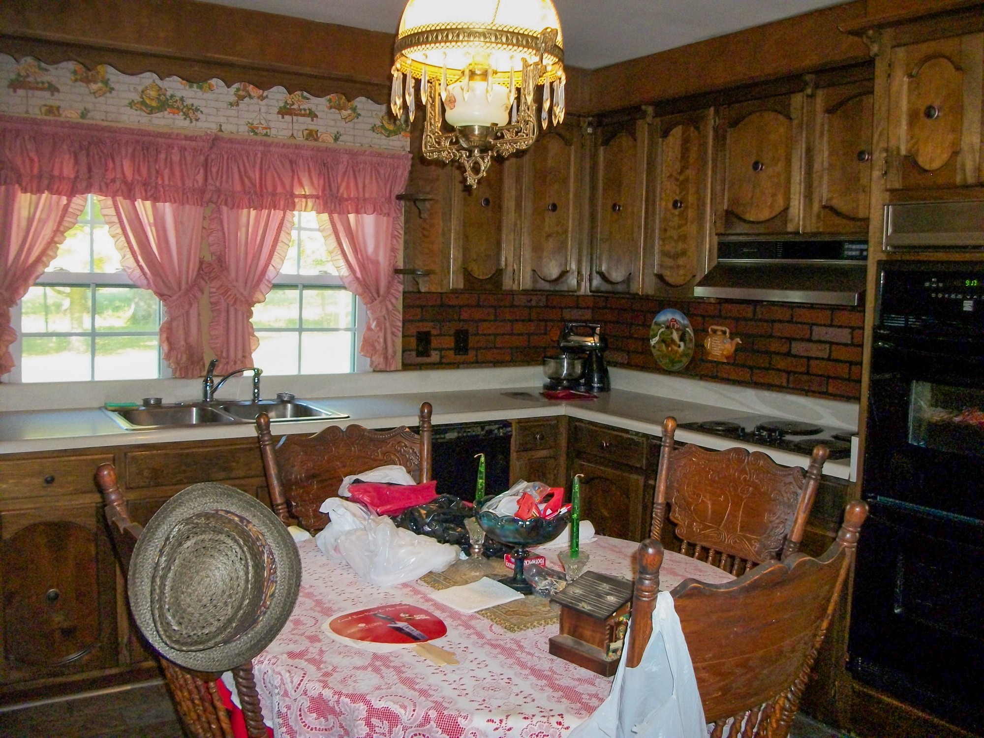 9670 Panther Creek Road Christiana, TN 37037 - Photo 8 of 16 a kitchen with sink a window and chairs