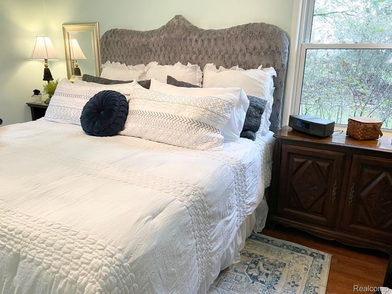 929 Main Street Fenton, MI 48430 - Photo 16 of 28 Master bedroom with hardwood flooring.