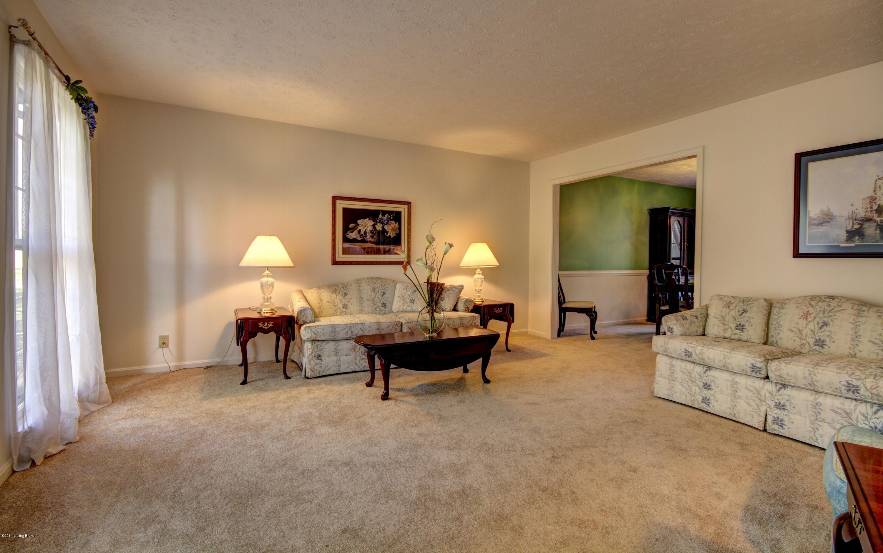7602 Tempsclair Road Louisville, KY 40220 - Photo 11 of 44 Long windows add lots of light to the interior and new carpet.