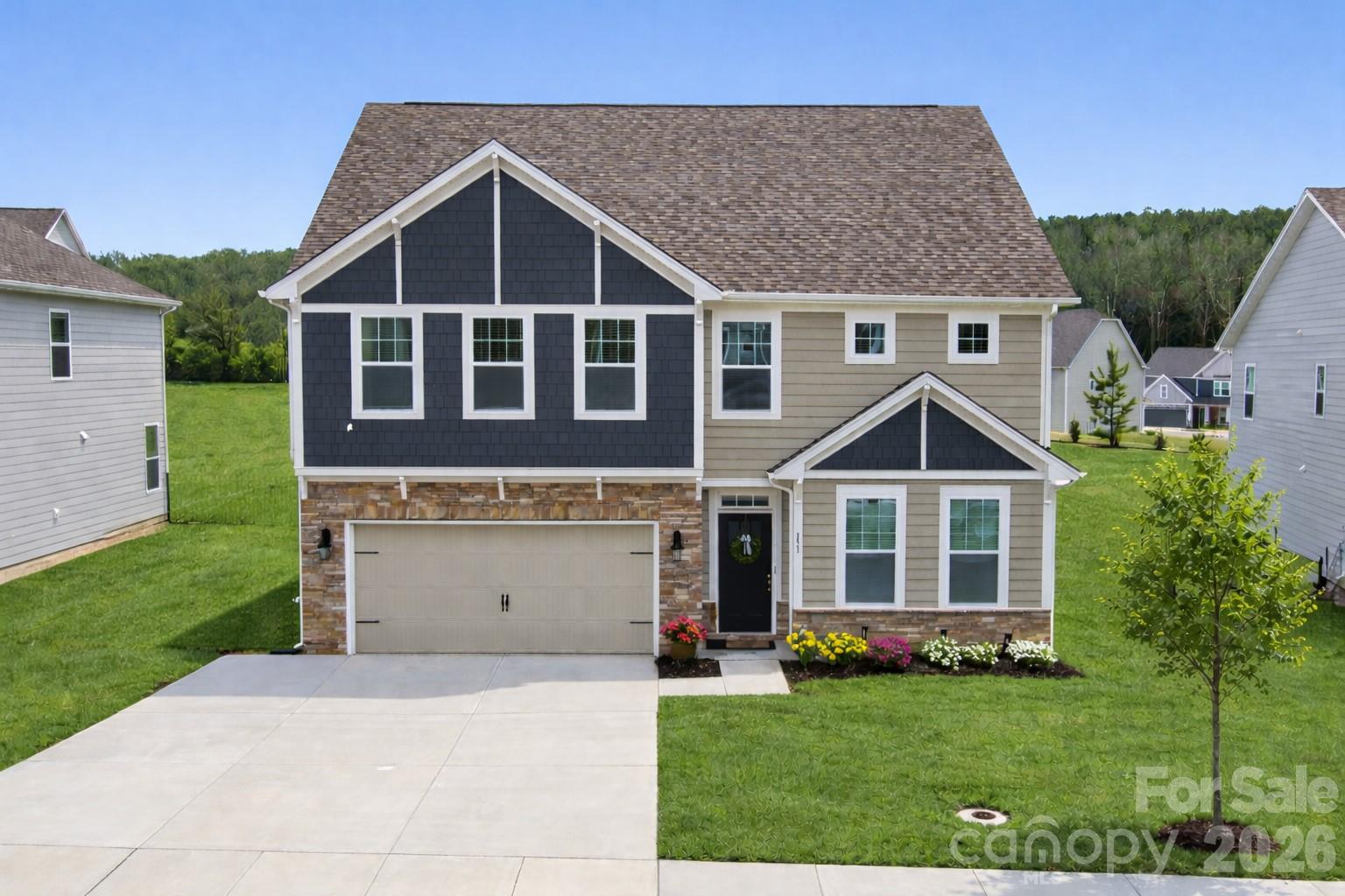 151 Aviendha Lane Troutman, NC 28166 - Photo 1 of 43 a front view of a house with a yard