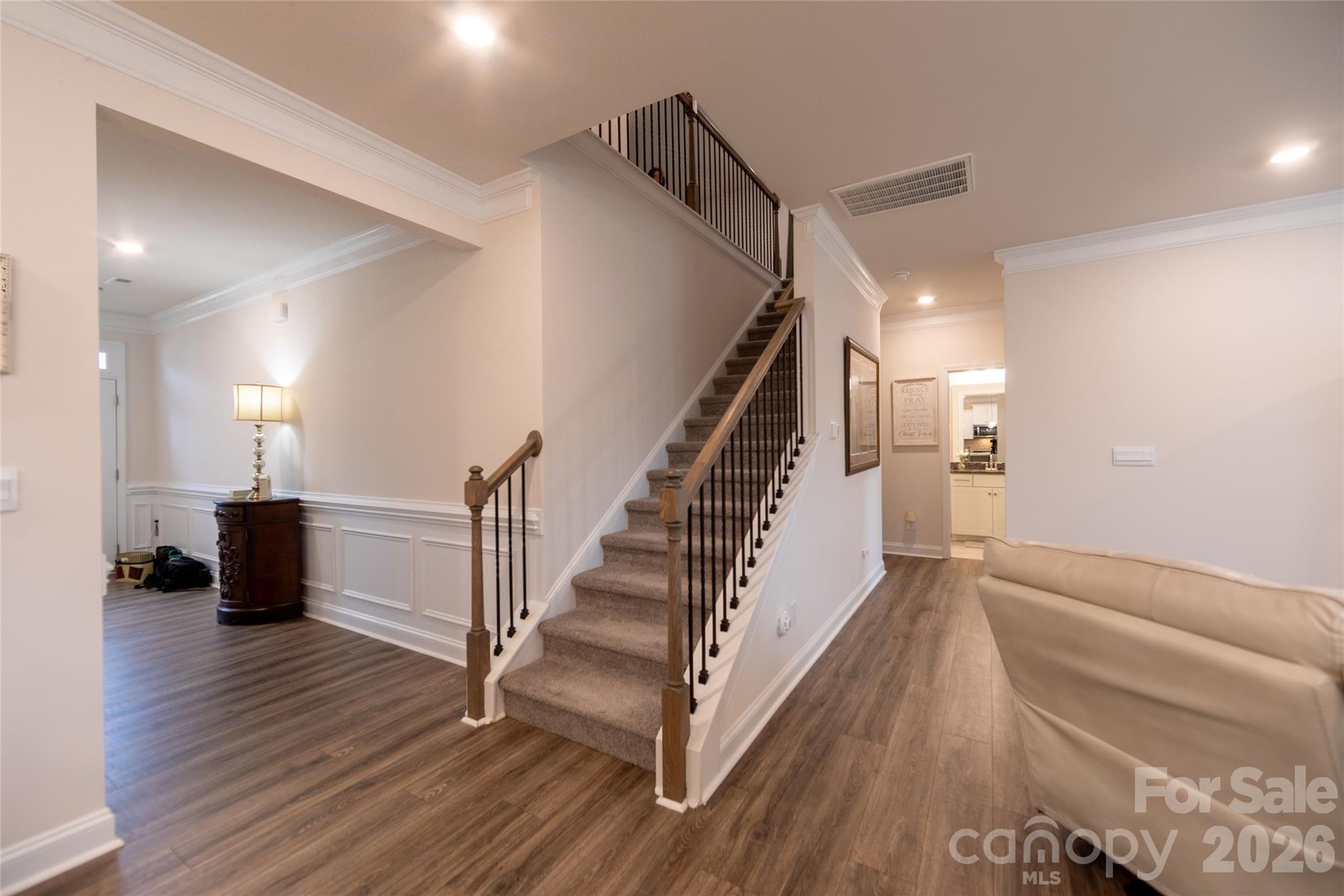 151 Aviendha Lane Troutman, NC 28166 - Photo 19 of 43 a view of entryway and hall with wooden floor