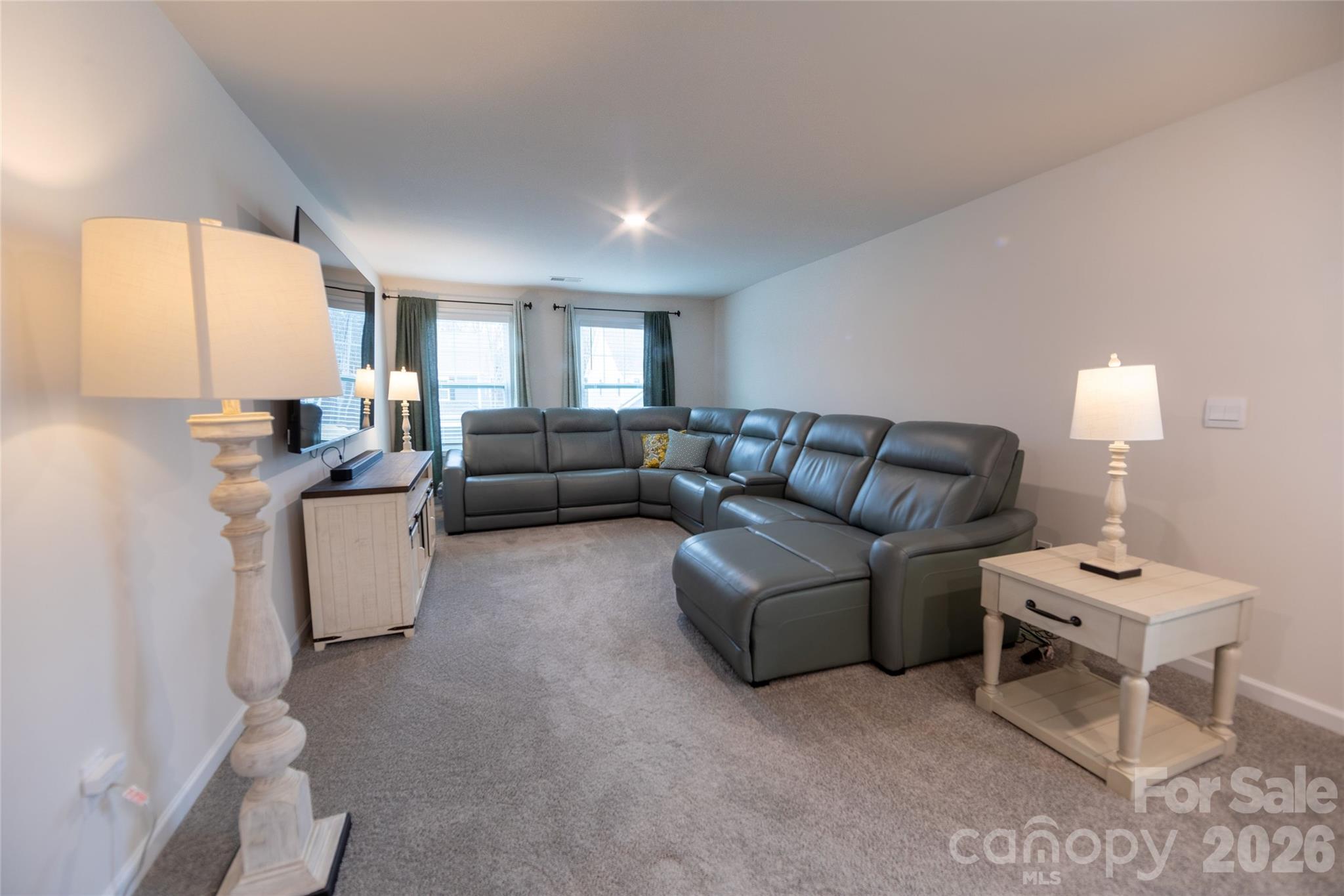 151 Aviendha Lane Troutman, NC 28166 - Photo 20 of 43 a living room with furniture and a window