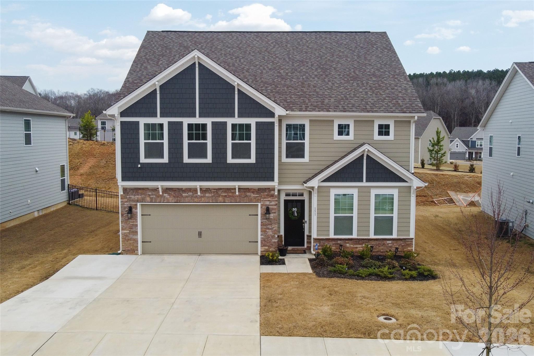 151 Aviendha Lane Troutman, NC 28166 - Photo 2 of 43 a front view of a house with a yard